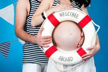 Happy parents await the birth of a baby clipart