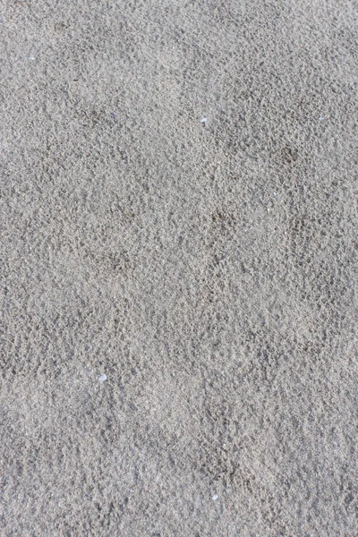 Šedá nerovnoměrné špinavé a suchý písek — Stock fotografie