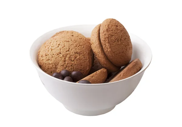 Oatmeal cookies and chocolate candy — Stock Photo, Image