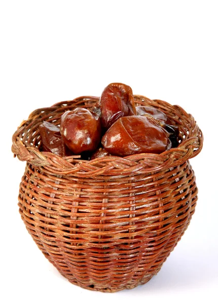 Dates in the bamboo jar on white background — Stock Photo, Image