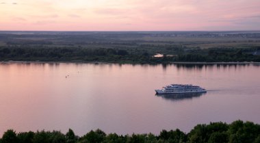 River boat cruise on Volga River at sunset in Nizhny Novgoro clipart