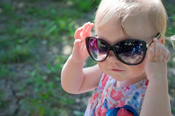 stock image The little girl walks outdoors