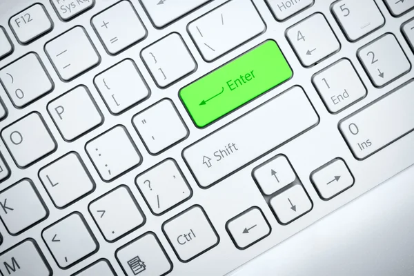 Computer keyboard with green button — Stock Photo, Image