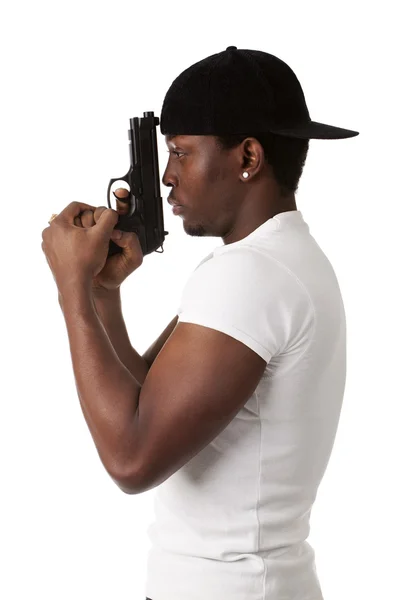 Молодой бандит с пистолетом — стоковое фото