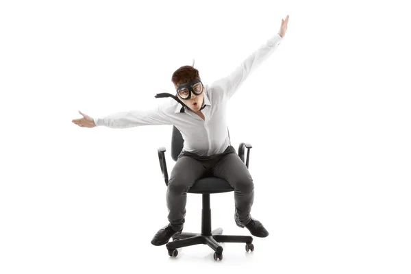 Funny young man on chair — Stockfoto