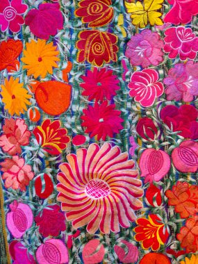 Detail embroidery of colorful flowers clipart