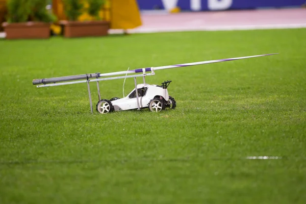 stock image Remote controlled car in the track carrying the javelin