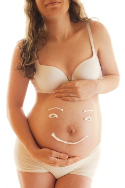 Pregnant's woman belly with creame smile clipart