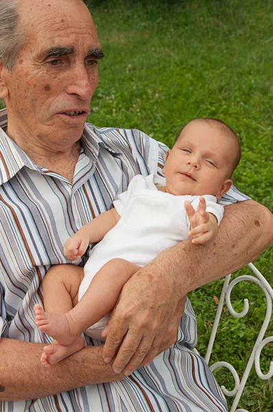 stock image Senior Man Holding His Great-grandson