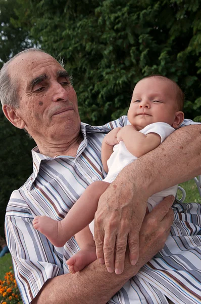 Senior Man Holding His Great-grandson — Stock Photo, Image