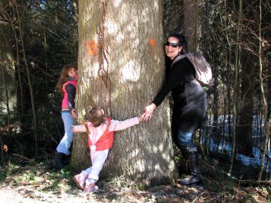 Family around the tree clipart