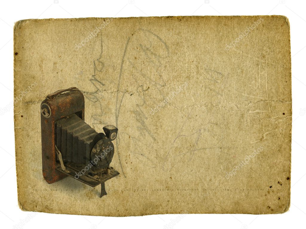 Old photographic camera on vintage background