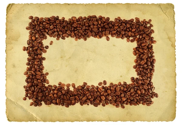 Granos de café sobre fondo vintage —  Fotos de Stock