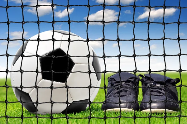 Soccer ball and shoes — Stock Photo, Image