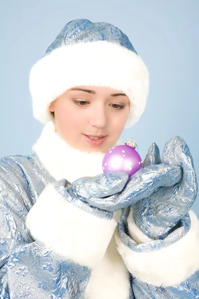 Girl in costume with new year toys — Stock Photo, Image