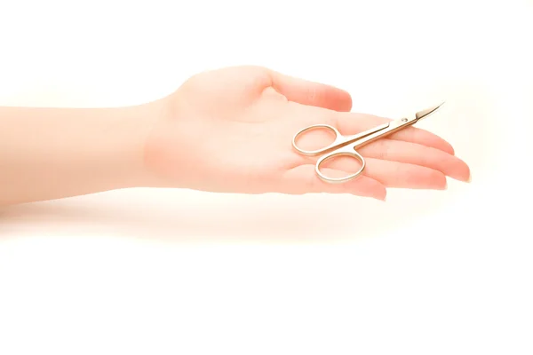 Woman's hand with manicure scissors — Stock Photo, Image