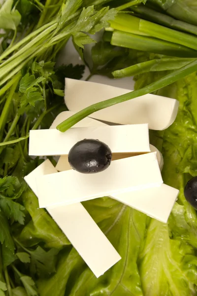 Feta cheese with black olives — Stock Photo, Image