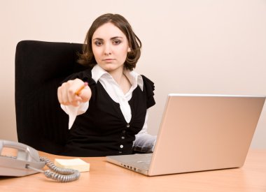 Young secretary with telephone and laptop clipart