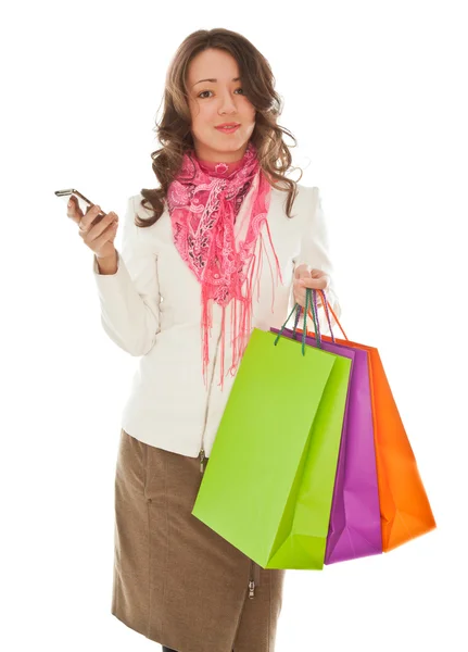 Mujer con bolsas de compras llamando por teléfono —  Fotos de Stock