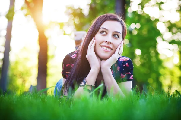 Pretty girl laying on the grass — Stock Photo, Image