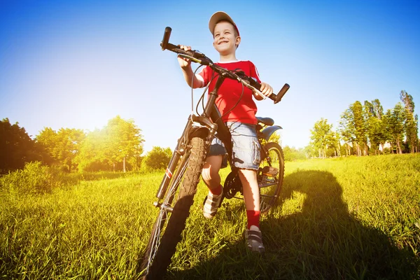 Six year old boy on a bike — Stock Photo, Image