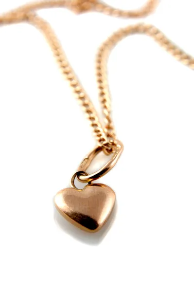 Gold heart pendant with chain — Stock Photo, Image