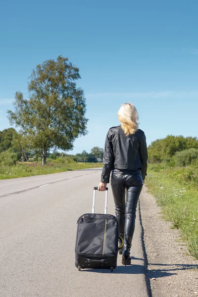 stock image Hitchhiker walking along a rural road