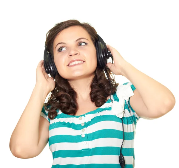 Hezká dívka poslouchá hudbu se sluchátky a vyhledávání — Stock fotografie