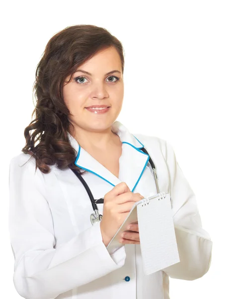 Девушка в халате медсестра написала в блокноте — стоковое фото