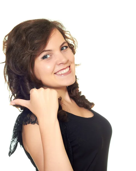 Visar en leende flicka med fingret till vänster — Stockfoto