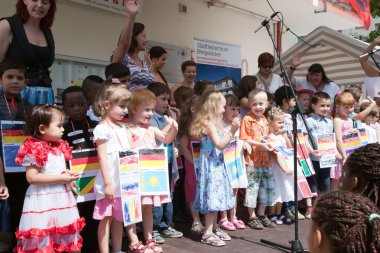 GERMANY. Baden-Baden. June 16, 2012, the Feast of the urban area. Children from kindergarten opening celebration of urban area. clipart