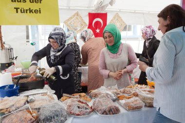 Women cook traditional Turkish food. clipart