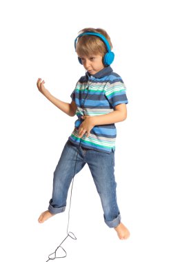 Boy playing air guitar and dancing clipart