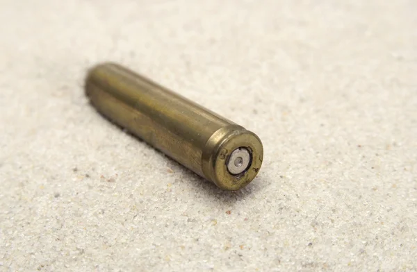 Bullet on sand — Stock Photo, Image