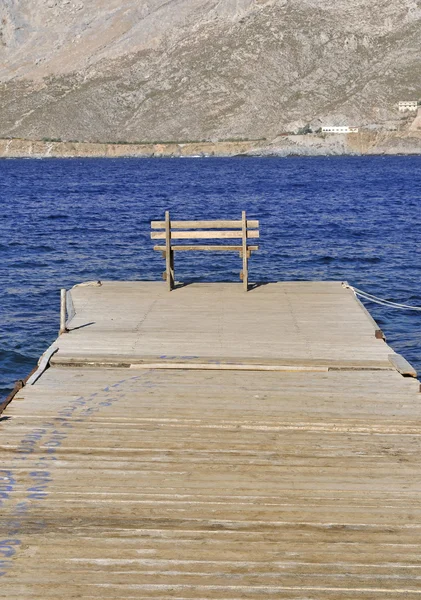 Wooden jetty and bench — Stock Photo, Image