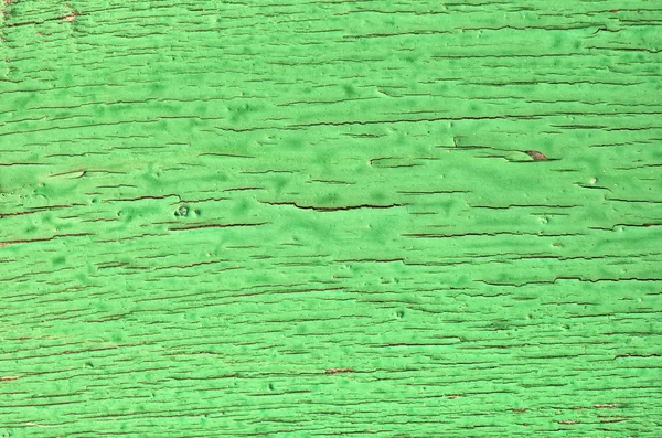 Сломанная краска на зеленой стене — стоковое фото