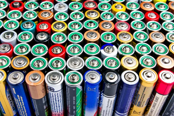 Row of different batteries — Stock Photo, Image
