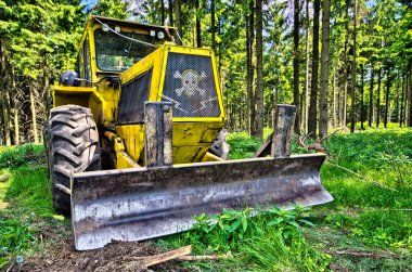 Bulldozer in the forest clipart