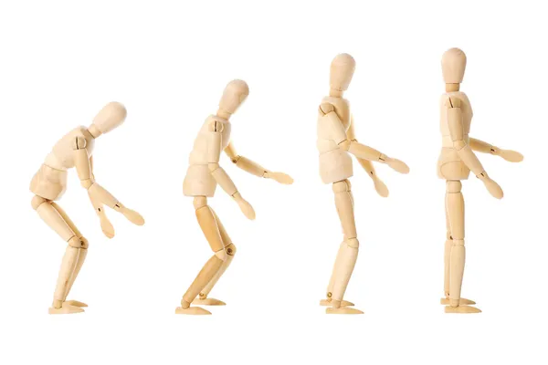 Bonecas de madeira com posturas diferentes — Fotografia de Stock