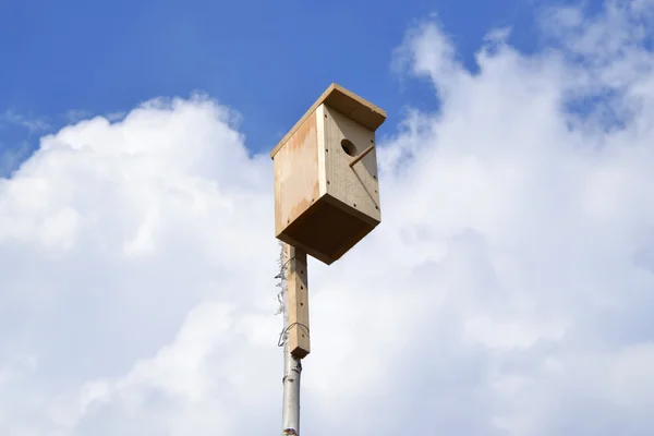 stock image Lodge for birds against the sky. Starling house.