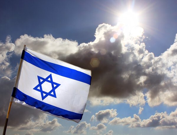 Israeli flag against cloudy sky