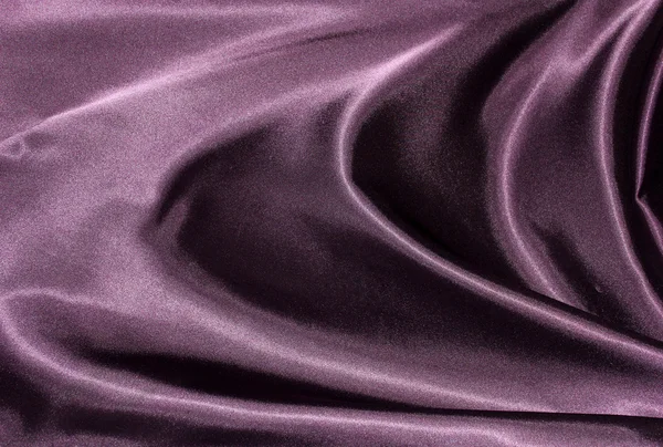Волнистый фиолетовый шелк — стоковое фото