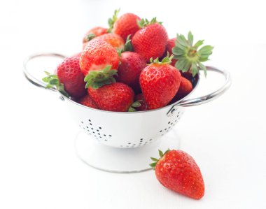 Strawberries in a white drushlake isolated background clipart