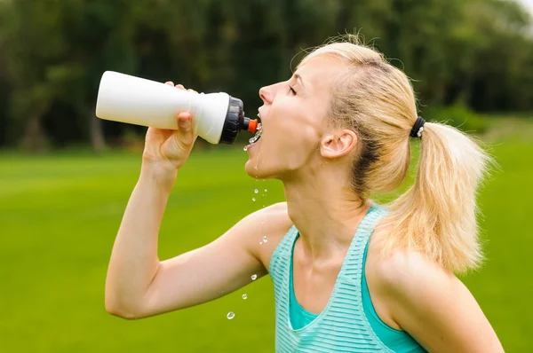 stock image Young girl drinking water