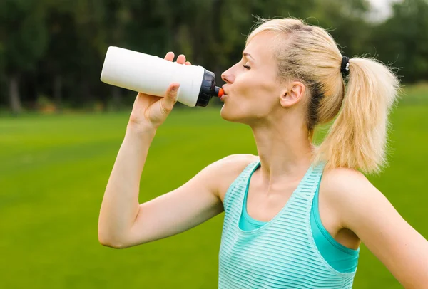 stock image Young girl drinking water