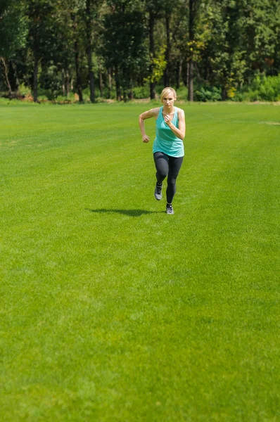 stock image Portrait of a young woman jogging