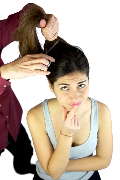 Menina duvidando sobre o corte de cabelo — Fotografia de Stock