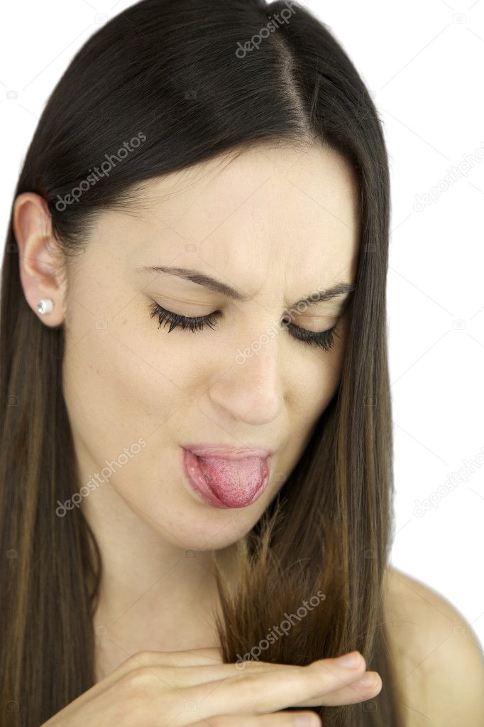 Angry girl making tongue to ruined hair