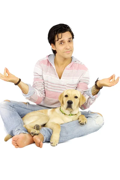 stock image Young man with puppy labrador dog playing yoga position