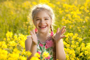 Blonde girl claps his hands clipart